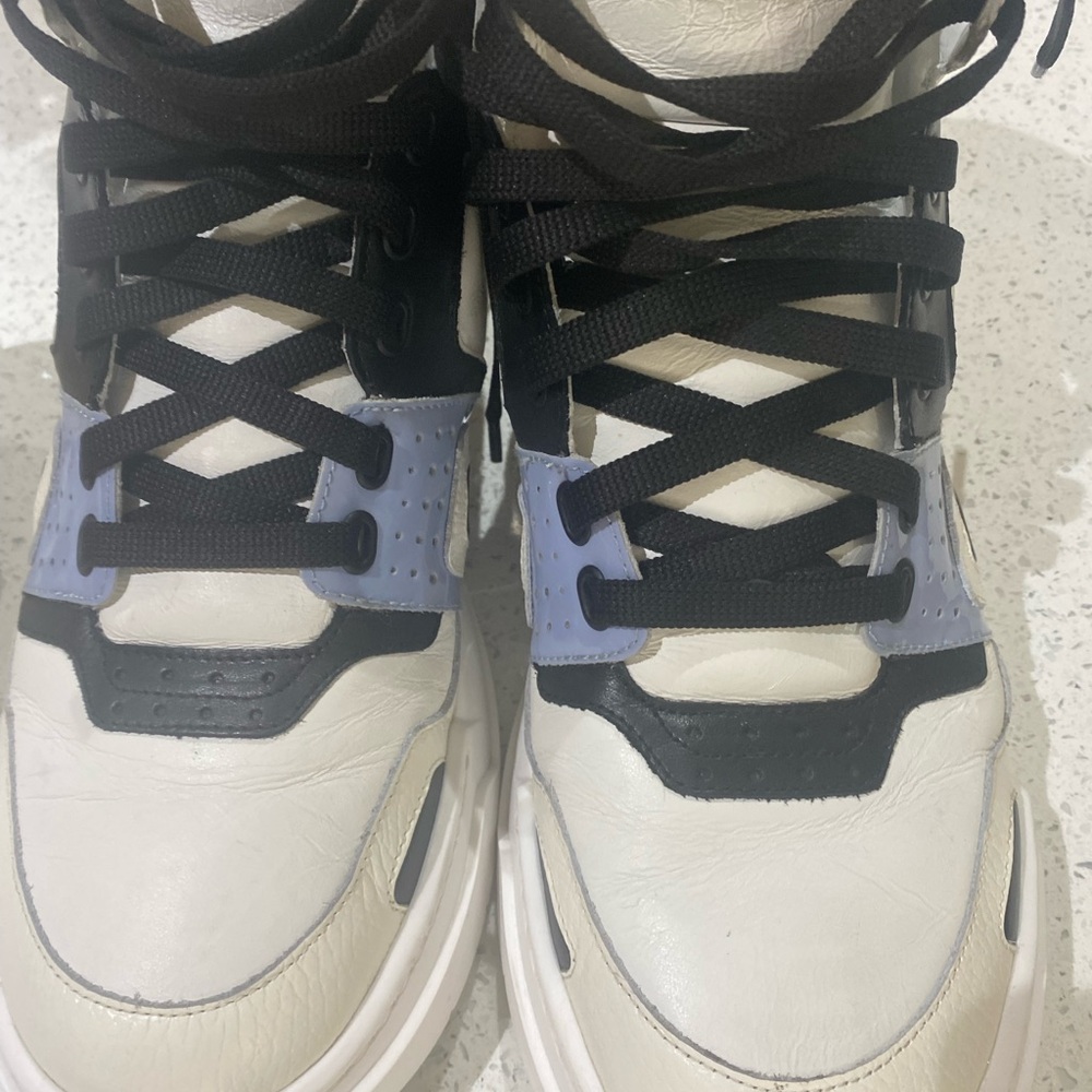 MCM Black and White Sneakers. Leather high-top MCM logo sneaker.